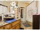 Bathroom vanity with granite countertops, decorative bowl sink, and storage at 4401 Inez Dr, Las Vegas, NV 89130