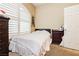 Cozy bedroom featuring natural light from the window with white shutters at 4401 Inez Dr, Las Vegas, NV 89130