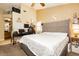 Comfortable bedroom featuring vaulted ceilings, a dedicated workspace and neutral colors at 4401 Inez Dr, Las Vegas, NV 89130