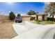 Lovely home with a spacious driveway, attached garage, and charming landscaping at 4401 Inez Dr, Las Vegas, NV 89130