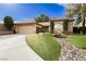 Charming home with beautiful landscaping, decorative bridge and well-manicured front yard at 4401 Inez Dr, Las Vegas, NV 89130