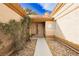 Inviting front entrance features a charming walkway and beautiful desert landscaping at 4401 Inez Dr, Las Vegas, NV 89130