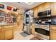 Well-appointed kitchen includes stainless steel appliances, granite countertops, and warm wood cabinetry at 4401 Inez Dr, Las Vegas, NV 89130
