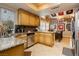 Updated kitchen boasts granite countertops, stainless appliances, and a mosaic tile backsplash at 4401 Inez Dr, Las Vegas, NV 89130