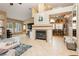 Inviting living room with fireplace, tile floors, and adjacent dining area at 4401 Inez Dr, Las Vegas, NV 89130