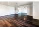 Bright living room with dark laminate wood floors and an open floor plan at 484 National St, Henderson, NV 89015