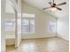 Bright bedroom with tile floors, ceiling fan, and en-suite bathroom access at 5055 Jacarilla Ln, North Las Vegas, NV 89031