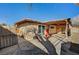 Backyard view showcasing a covered patio and large tree at 5069 Hallet Dr, Las Vegas, NV 89122