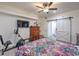 Spacious bedroom with a queen bed, exercise equipment, and barn door at 508 Indian Princess Dr # 101, Las Vegas, NV 89145