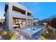 Luxury backyard with hot tub, patio furniture, and modern landscaping at 5219 Iron River Ct, Las Vegas, NV 89135