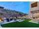 Landscaped backyard with fire pit and seating area at 5219 Iron River Ct, Las Vegas, NV 89135