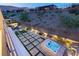 Spacious backyard oasis with hot tub, fire pit, and artificial turf at 5219 Iron River Ct, Las Vegas, NV 89135