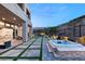Stunning backyard featuring a hot tub, patio, and grassy area at 5219 Iron River Ct, Las Vegas, NV 89135