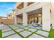 Backyard with covered patio, firepit, and artificial turf at 5219 Iron River Ct, Las Vegas, NV 89135