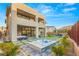 Modern backyard oasis with hot tub and expansive patio at 5219 Iron River Ct, Las Vegas, NV 89135