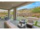 Spacious backyard with covered patio, hot tub, and seating at 5219 Iron River Ct, Las Vegas, NV 89135