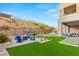 Landscaped backyard featuring a firepit and seating area at 5219 Iron River Ct, Las Vegas, NV 89135