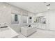 Luxurious bathroom with marble finishes and soaking tub at 5219 Iron River Ct, Las Vegas, NV 89135