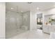Bathroom with walk-in shower and marble finishes at 5219 Iron River Ct, Las Vegas, NV 89135