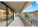 Covered patio with mountain views and sliding glass doors at 5219 Iron River Ct, Las Vegas, NV 89135