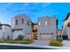 Modern home exterior with two-car garage and landscaping at 5219 Iron River Ct, Las Vegas, NV 89135