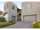 Modern home with two-car garage and manicured landscaping at 5219 Iron River Ct, Las Vegas, NV 89135