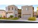 Modern two-story home with two-car garage and landscaped front yard at 5219 Iron River Ct, Las Vegas, NV 89135