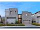 Modern home exterior with two-car garage and landscaping at 5219 Iron River Ct, Las Vegas, NV 89135