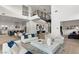Open floor plan boasts high ceilings, modern fireplace, and ample natural light at 5219 Iron River Ct, Las Vegas, NV 89135