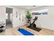 Bright home gym with Peloton bike,yoga mat, and resistance bands at 5219 Iron River Ct, Las Vegas, NV 89135