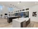 Open concept kitchen with two islands, stainless steel appliances, and views to backyard at 5219 Iron River Ct, Las Vegas, NV 89135