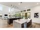 Open concept kitchen with two islands, stainless steel appliances, and views to backyard at 5219 Iron River Ct, Las Vegas, NV 89135