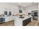 Modern kitchen with large island, stainless steel appliances, and white cabinetry at 5219 Iron River Ct, Las Vegas, NV 89135