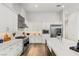 Bright kitchen with white cabinets, stainless steel appliances, and farmhouse sink at 5219 Iron River Ct, Las Vegas, NV 89135