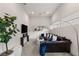 Comfortable media room with sectional sofa and large screen TV at 5219 Iron River Ct, Las Vegas, NV 89135