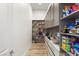 Well-organized pantry with ample shelving for storage at 5219 Iron River Ct, Las Vegas, NV 89135