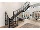 Modern floating staircase with metal railing and sleek design at 5219 Iron River Ct, Las Vegas, NV 89135