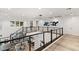 Modern upper landing with stylish railing overlooks the main level at 5219 Iron River Ct, Las Vegas, NV 89135