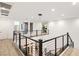 Modern upper-level hallway overlooking the main level at 5219 Iron River Ct, Las Vegas, NV 89135