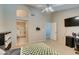 Spacious bedroom with large bed, en-suite bathroom, and office area at 5524 Desert Valley Dr, Las Vegas, NV 89149