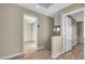 Upstairs hallway with light walls and wood-look flooring at 558 Poplar Leaf St, Las Vegas, NV 89144