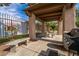Covered patio with grill, tables, and stone benches at 5751 E Hacienda Ave # 118, Las Vegas, NV 89122