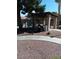 Community BBQ area with a pergola, grill, and seating at 5751 E Hacienda Ave # 118, Las Vegas, NV 89122