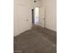 Carpeted bedroom with doors to hallway and another room at 5751 E Hacienda Ave # 118, Las Vegas, NV 89122
