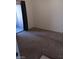 Carpeted bedroom with sliding door to patio at 5751 E Hacienda Ave # 118, Las Vegas, NV 89122