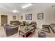 Community common area with brown leather couches at 5751 E Hacienda Ave # 118, Las Vegas, NV 89122