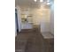 Bright dining area with a chandelier and carpet flooring at 5751 E Hacienda Ave # 118, Las Vegas, NV 89122