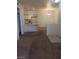 Bright dining area with a chandelier and carpet flooring at 5751 E Hacienda Ave # 118, Las Vegas, NV 89122
