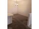 Bright dining area with a chandelier and carpet flooring at 5751 E Hacienda Ave # 118, Las Vegas, NV 89122