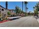 Gated community entrance with palm trees at 5751 E Hacienda Ave # 118, Las Vegas, NV 89122